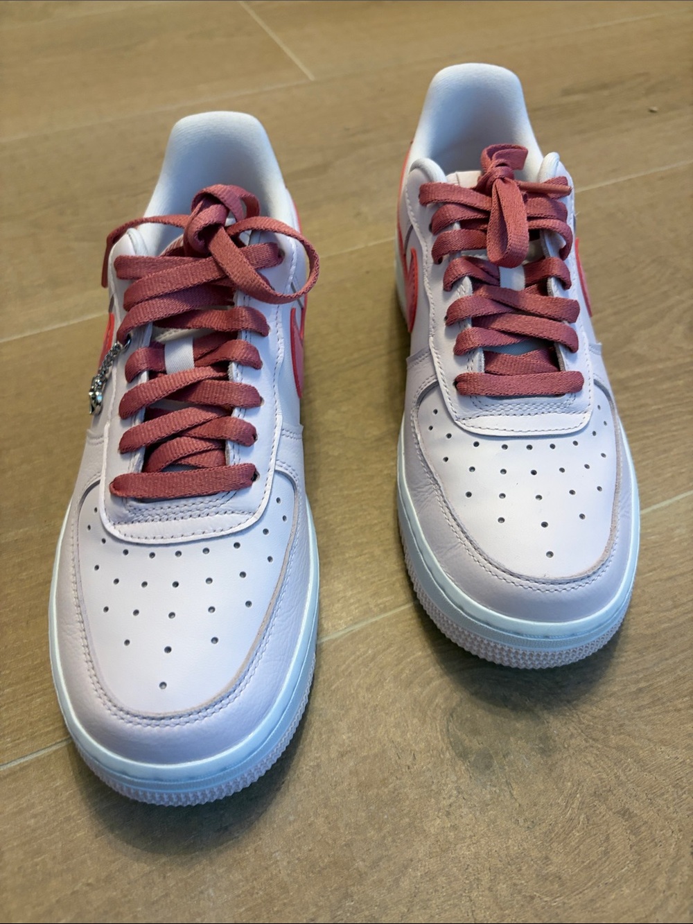 Nike Women’s Low-Top Sneakers in White with Mauve Accents